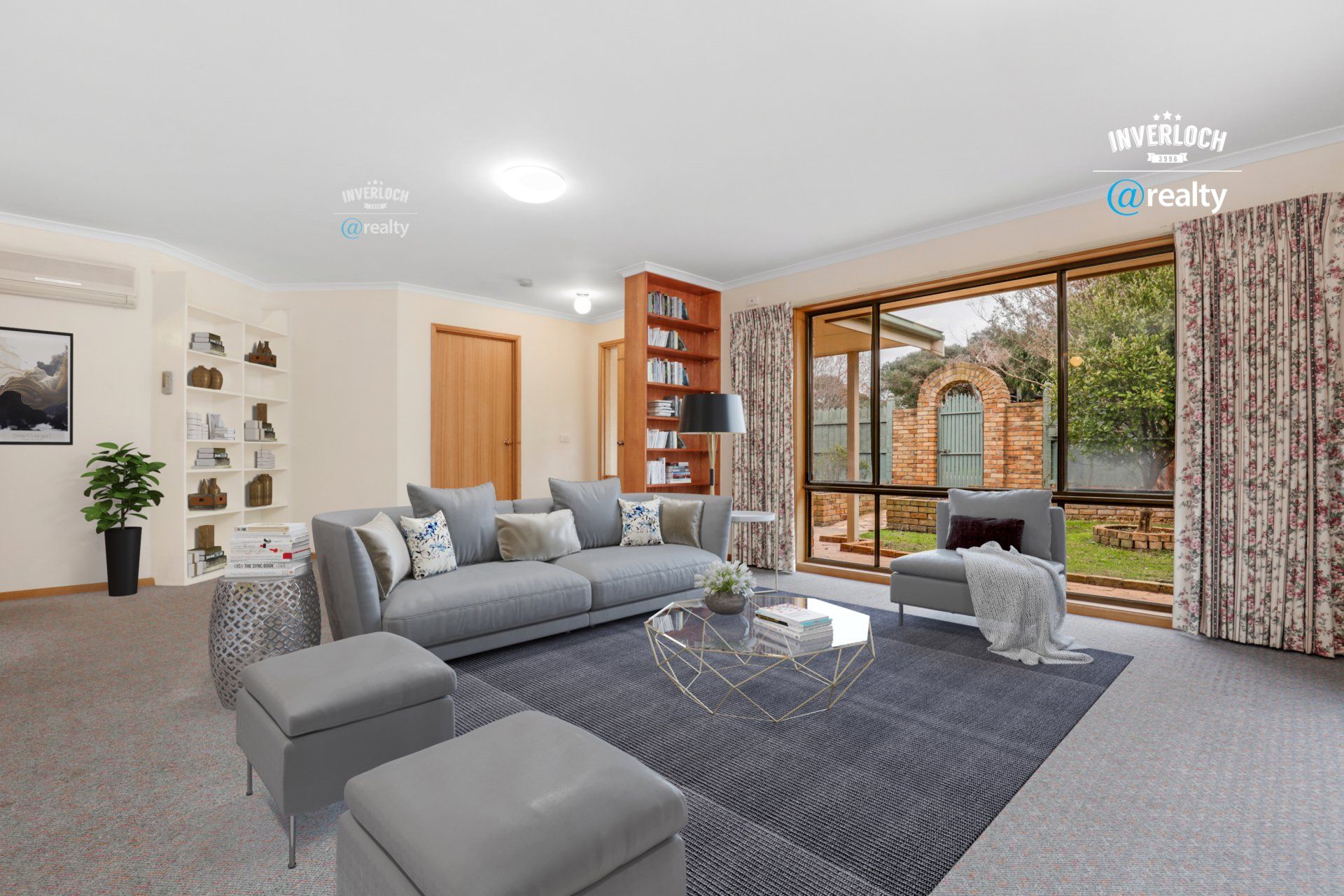 A living room with a couch , chairs , ottomans and a table.