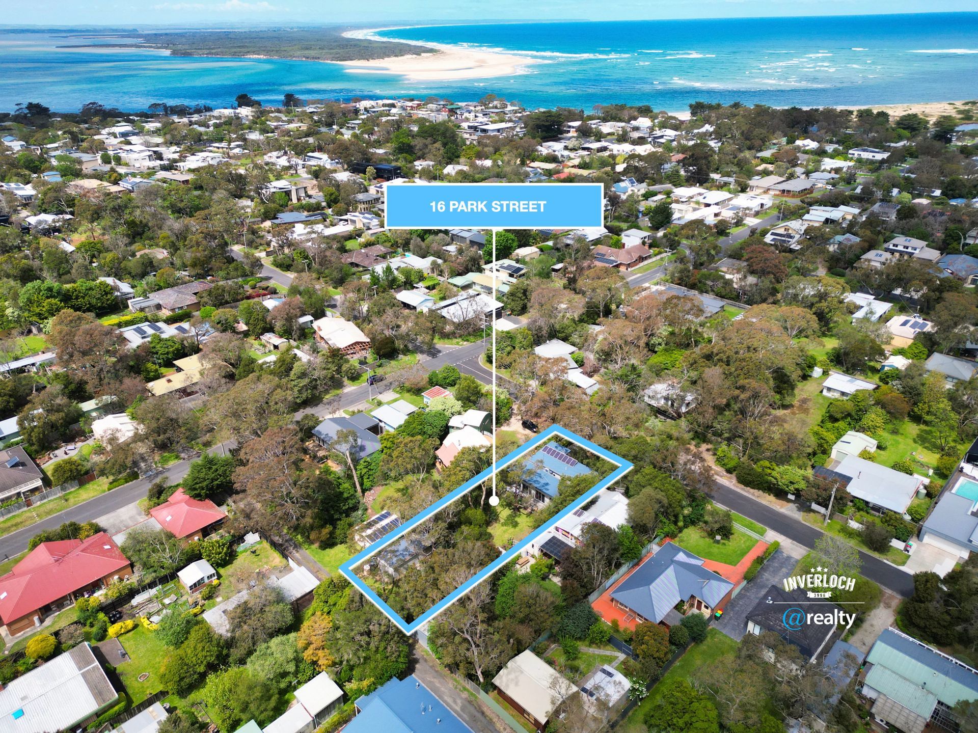 Aerial view of houses with a blue outlined property, located at 67 Nowranie Street, near water.