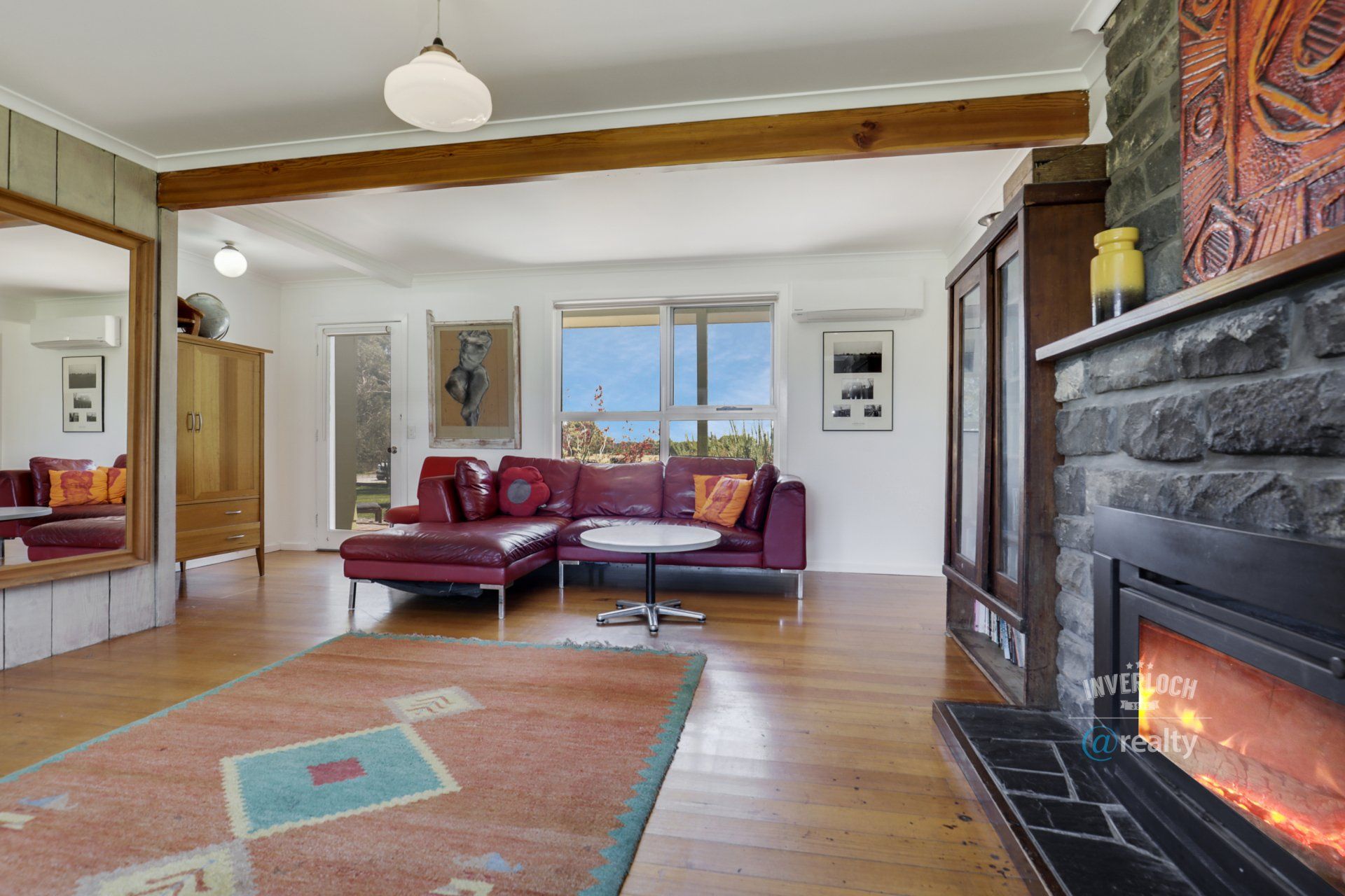 A living room with a fireplace and a couch