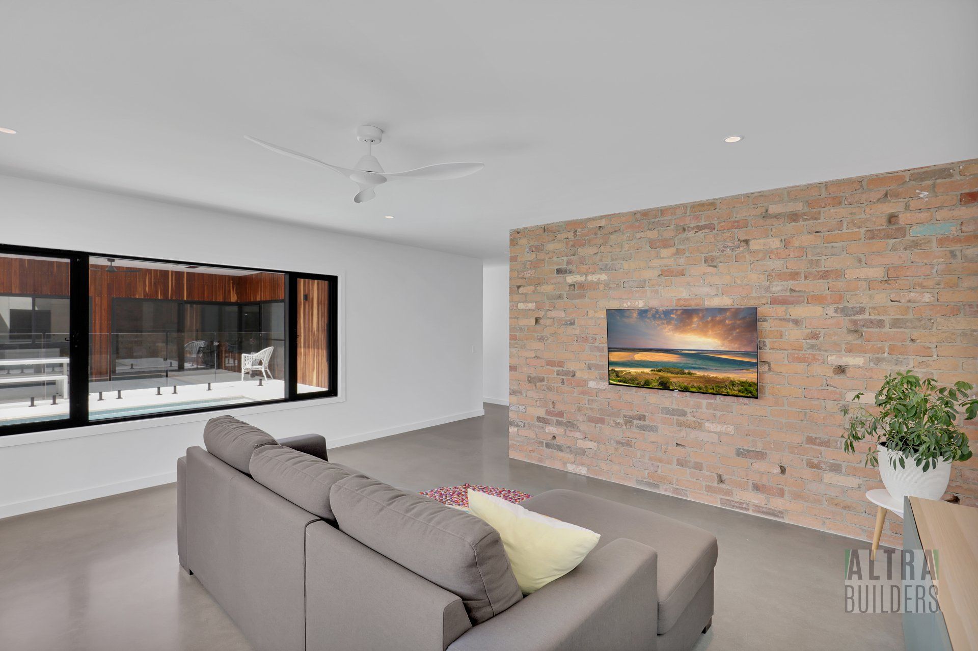 A living room with a couch and a painting on the wall