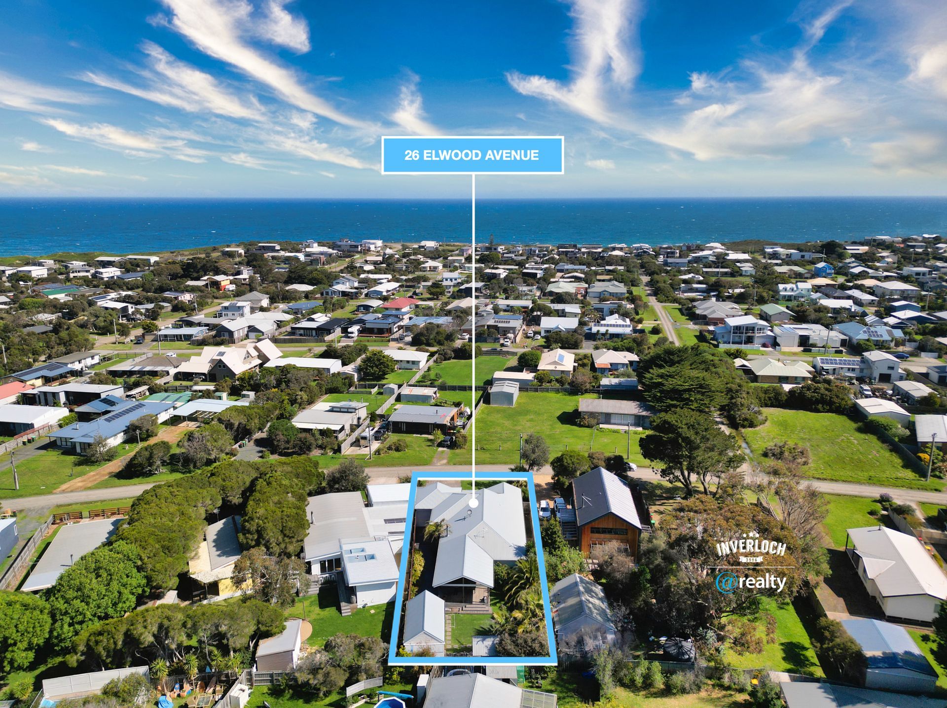 An aerial view of a residential area with a house in the middle.