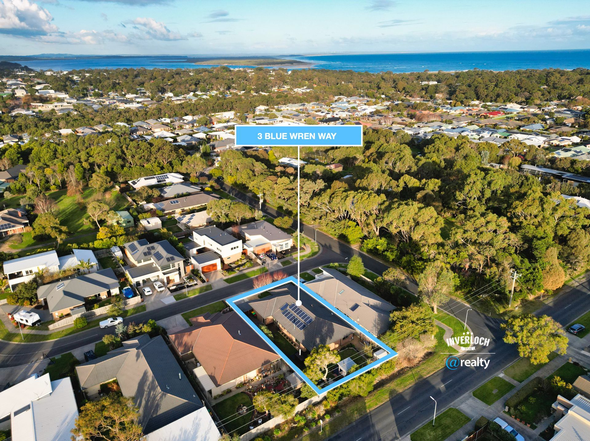 An aerial view of a residential area with a house in the middle