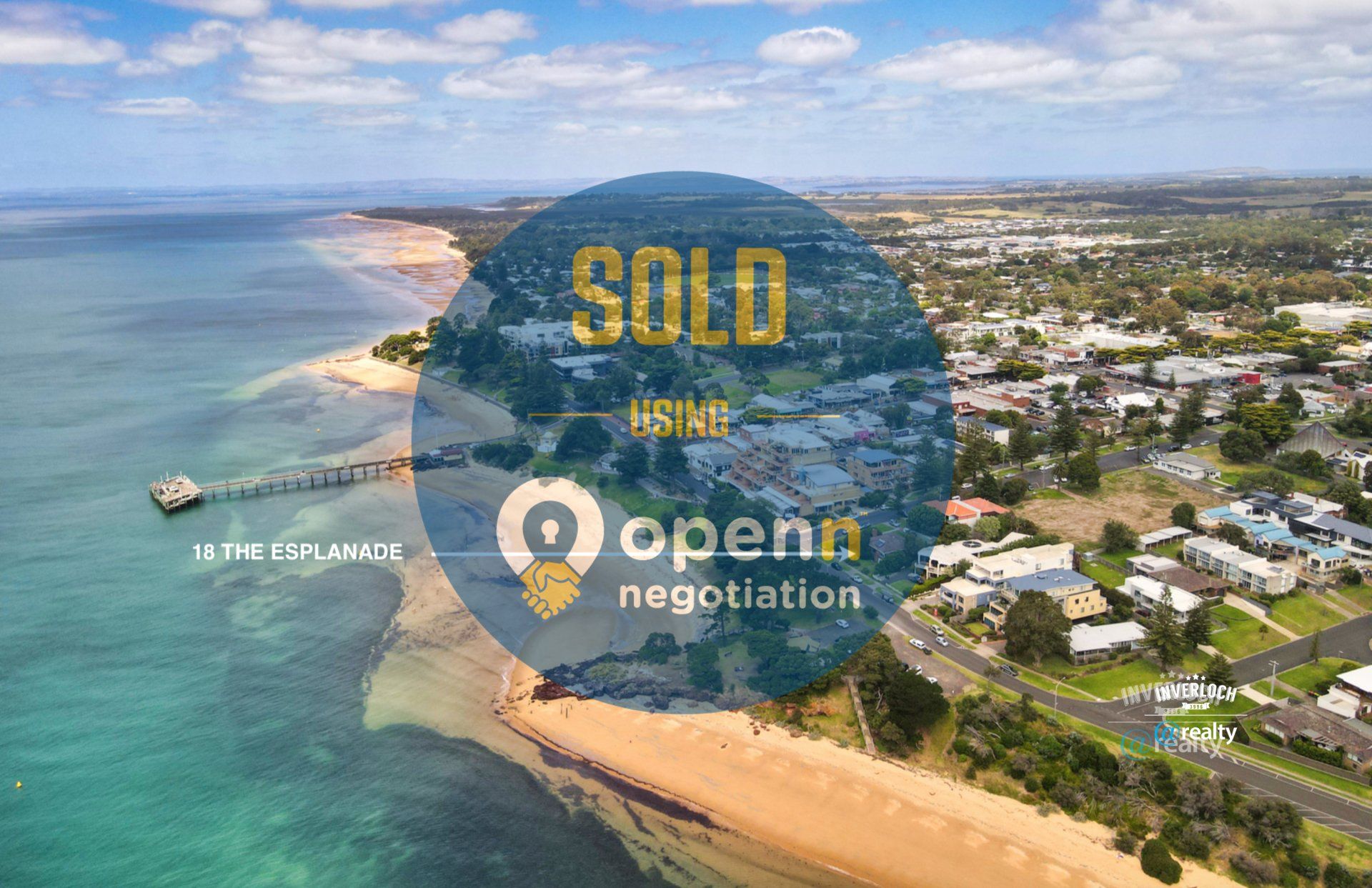 An aerial view of a city next to a body of water.