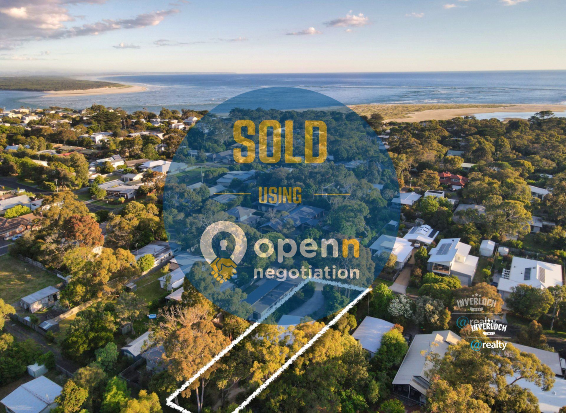 An aerial view of a residential area with the words sold using openn negotiation