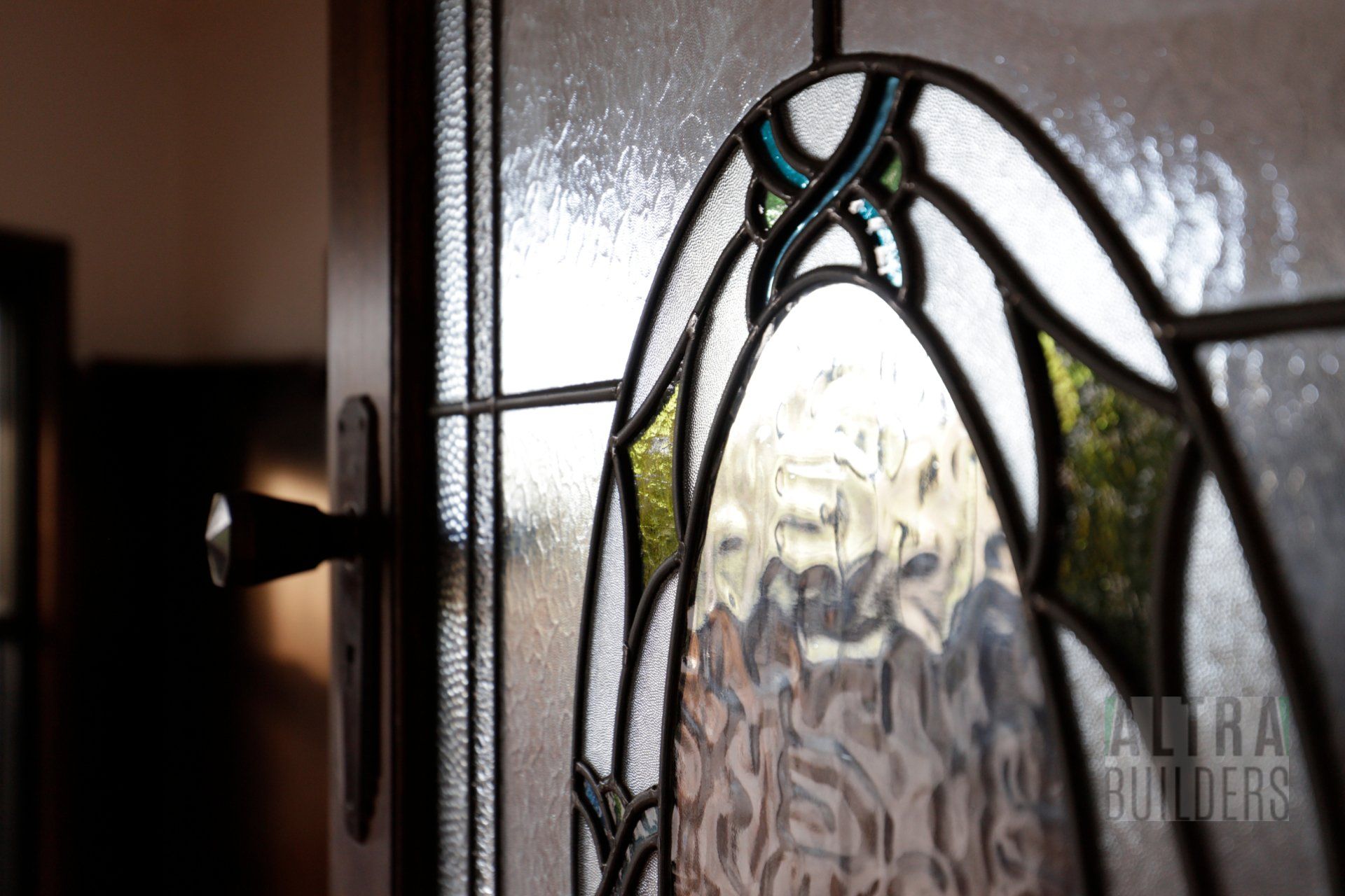 A close up of a stained glass window on a door.