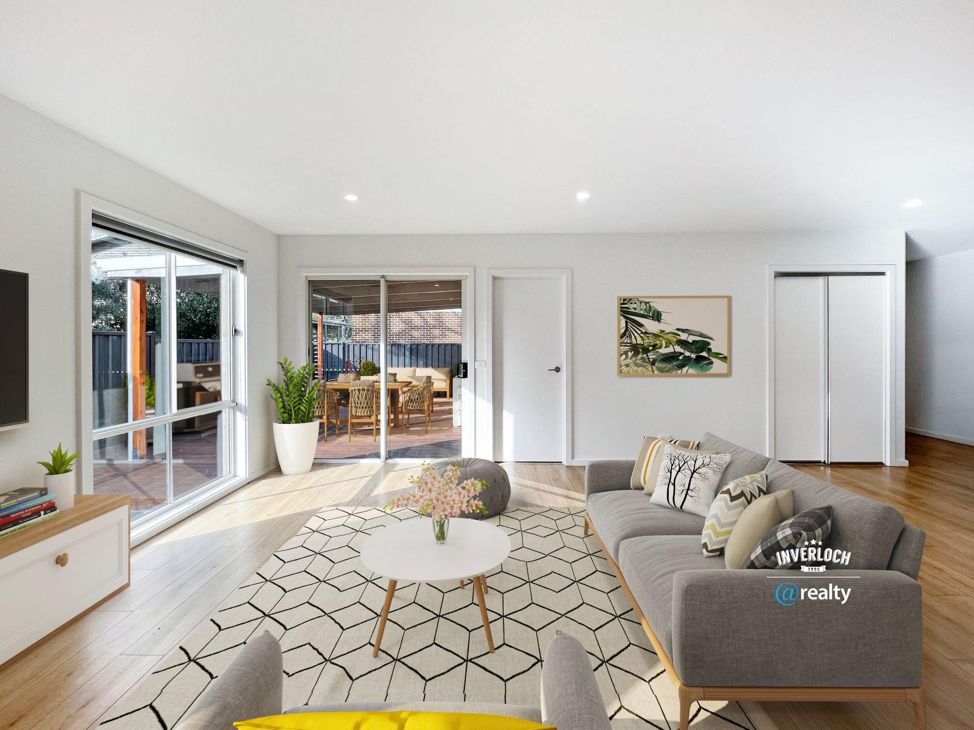 A living room with a couch , chairs , and a television.