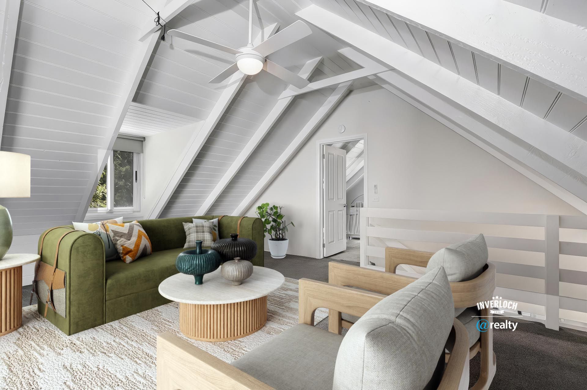 Living room with green sofa, wooden beams, white walls, and two armchairs.