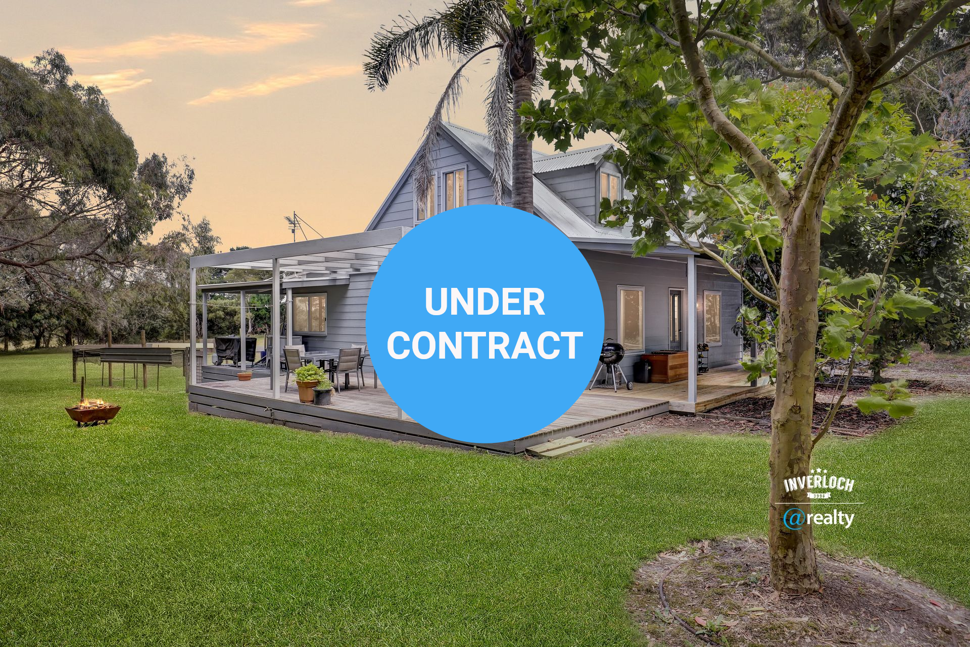 A large house with a large lawn in front of it.