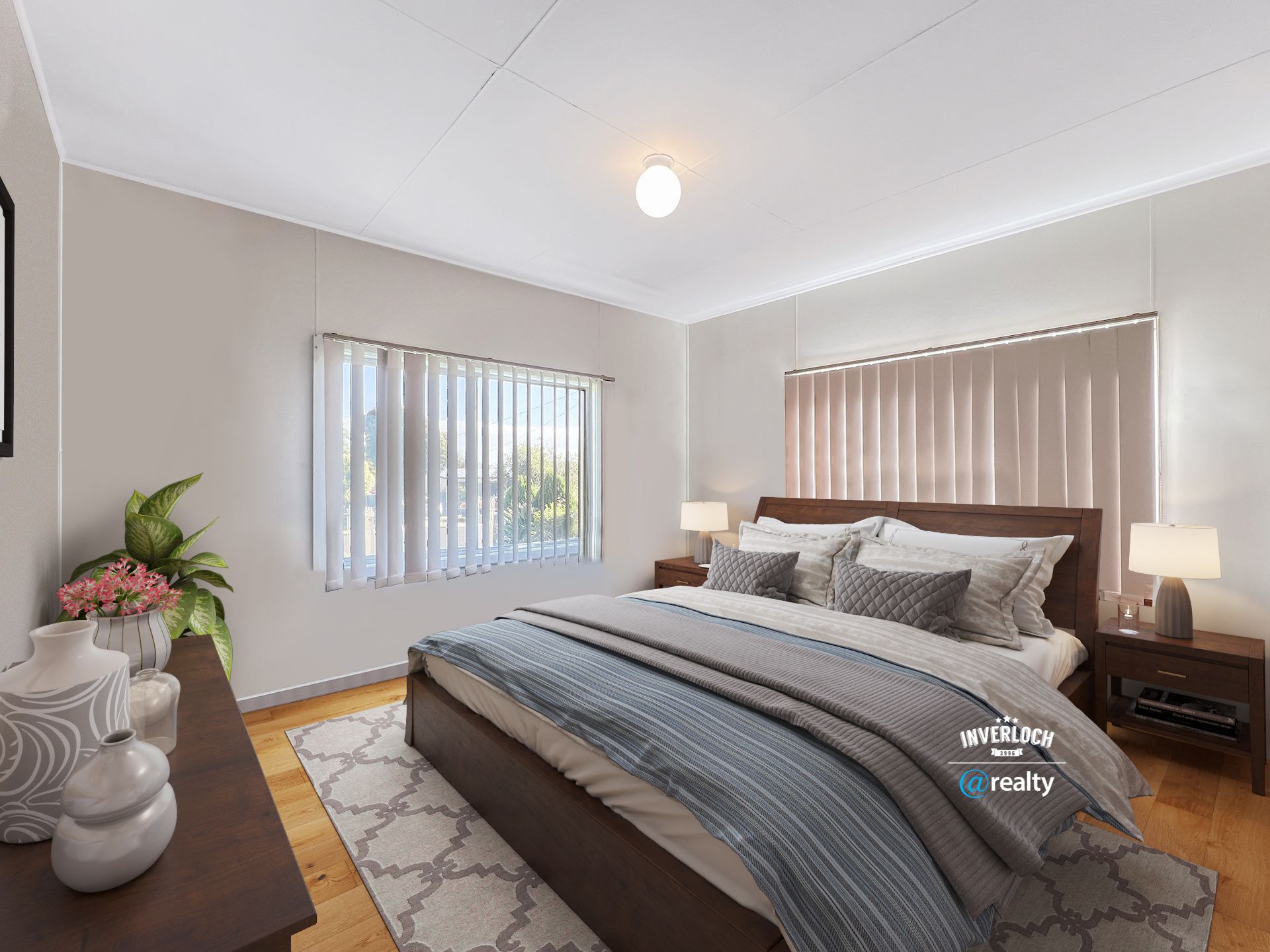 A bedroom with a large bed and a window.