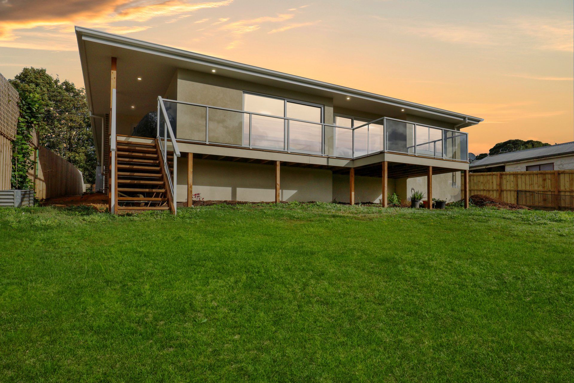 A large house with a large lawn in front of it.