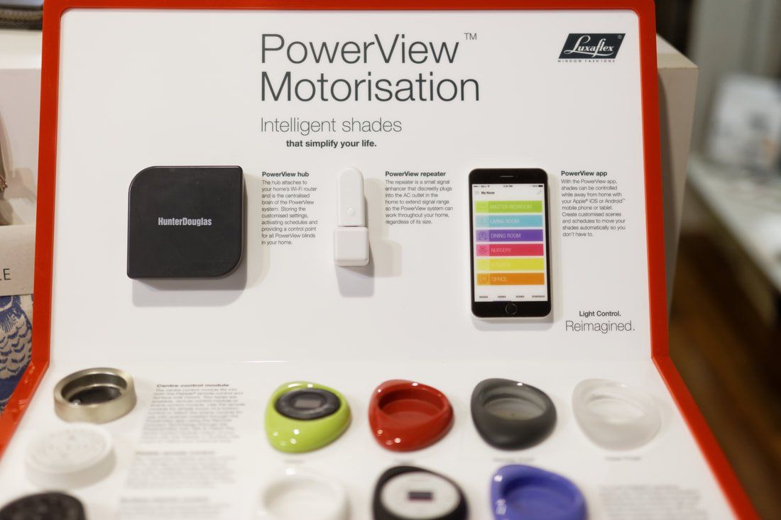 A powerview motorisation display with a phone on it