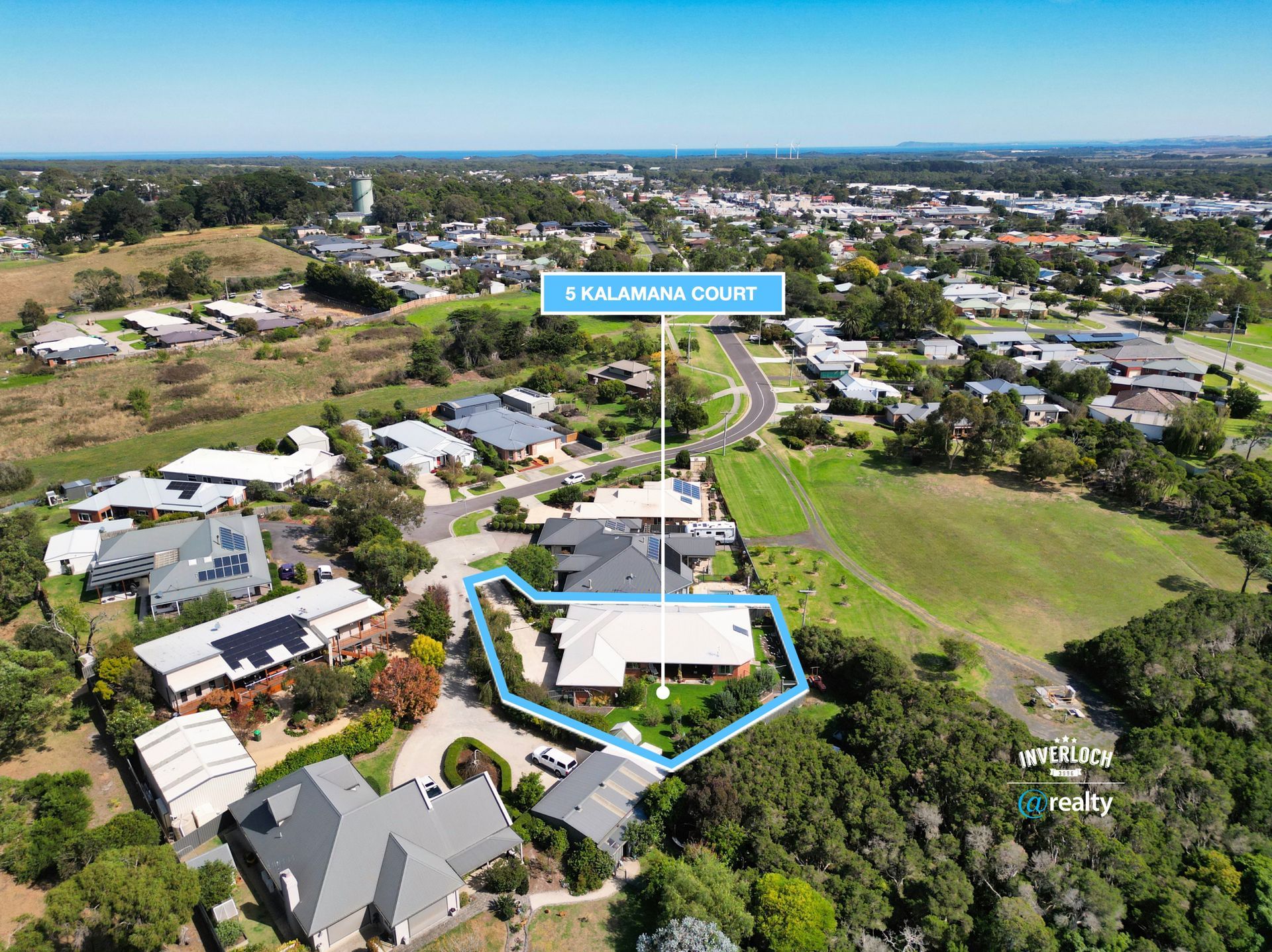 Aerial view of a residential house outlined in blue at 9 Kalamuna Court, surrounded by neighborhood streets and trees.