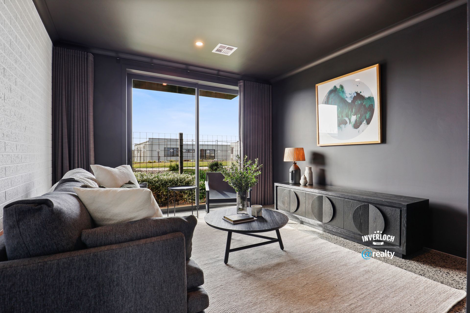 A living room with a couch and a coffee table