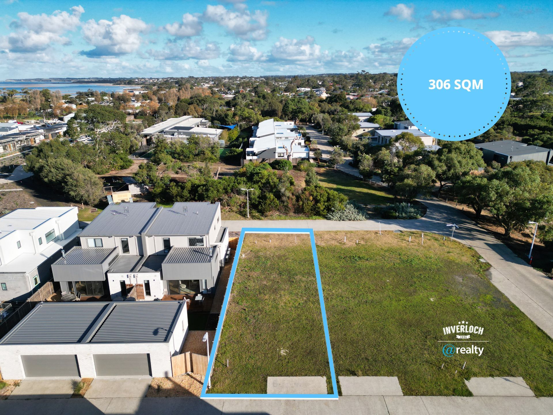 An aerial view of a residential area with a lot of grass and houses.