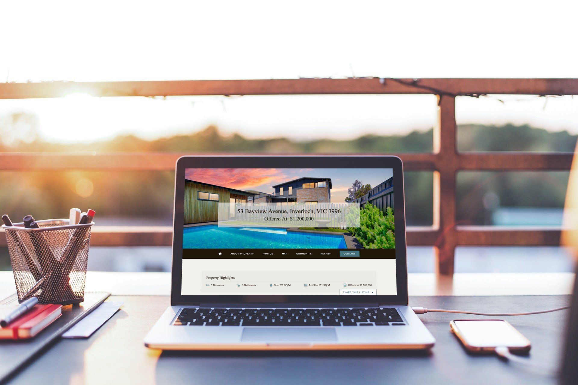 A laptop computer is open to a website on a desk.