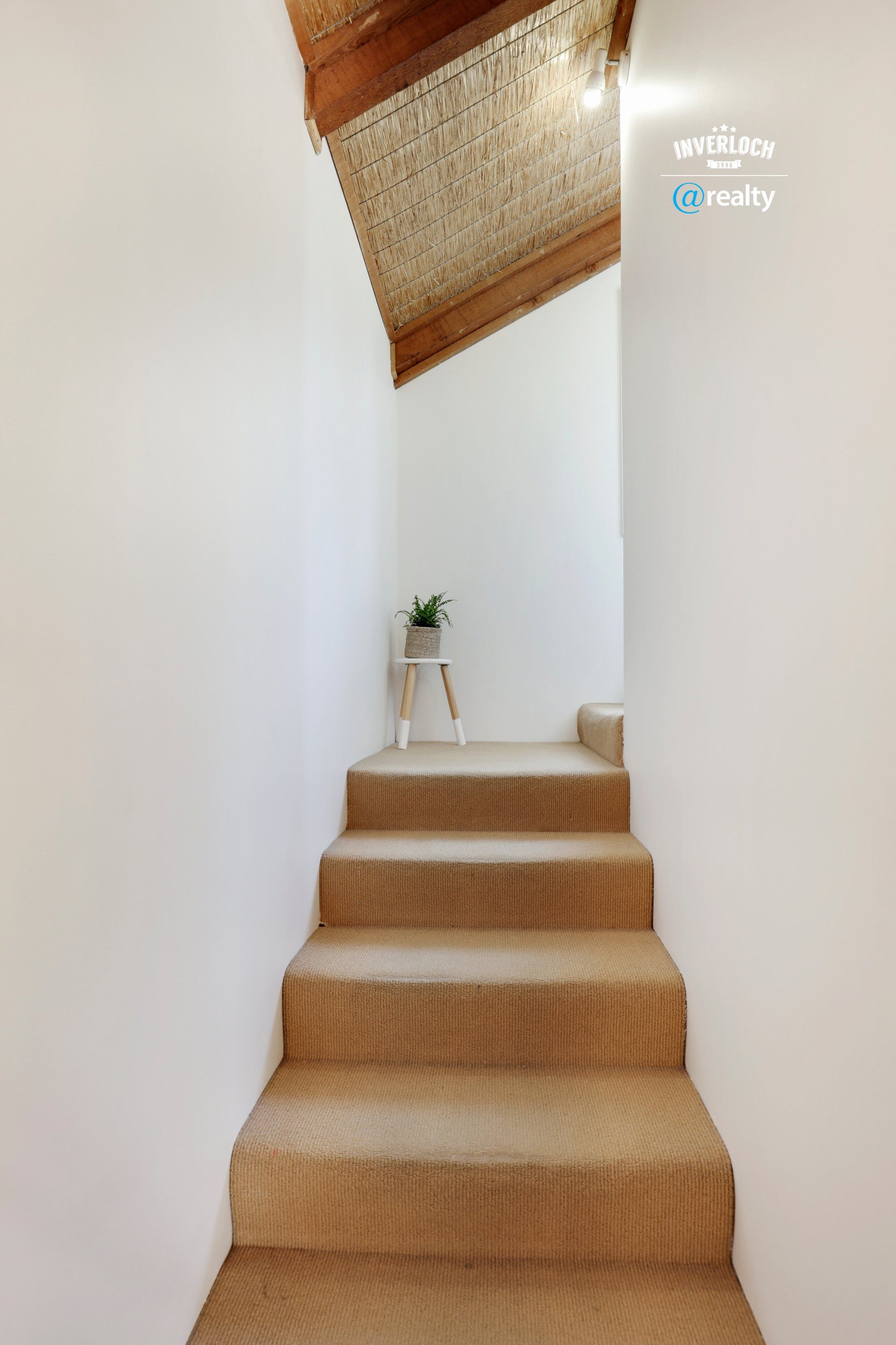 A set of stairs leading up to the second floor of a house.