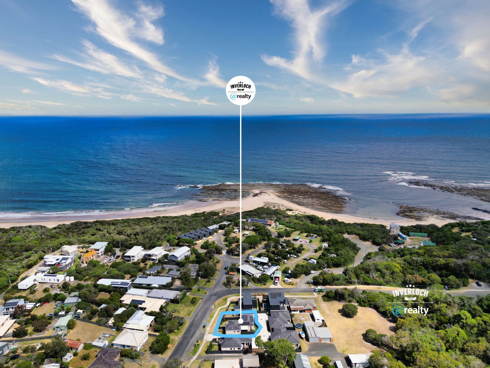 An aerial view of a house near the ocean