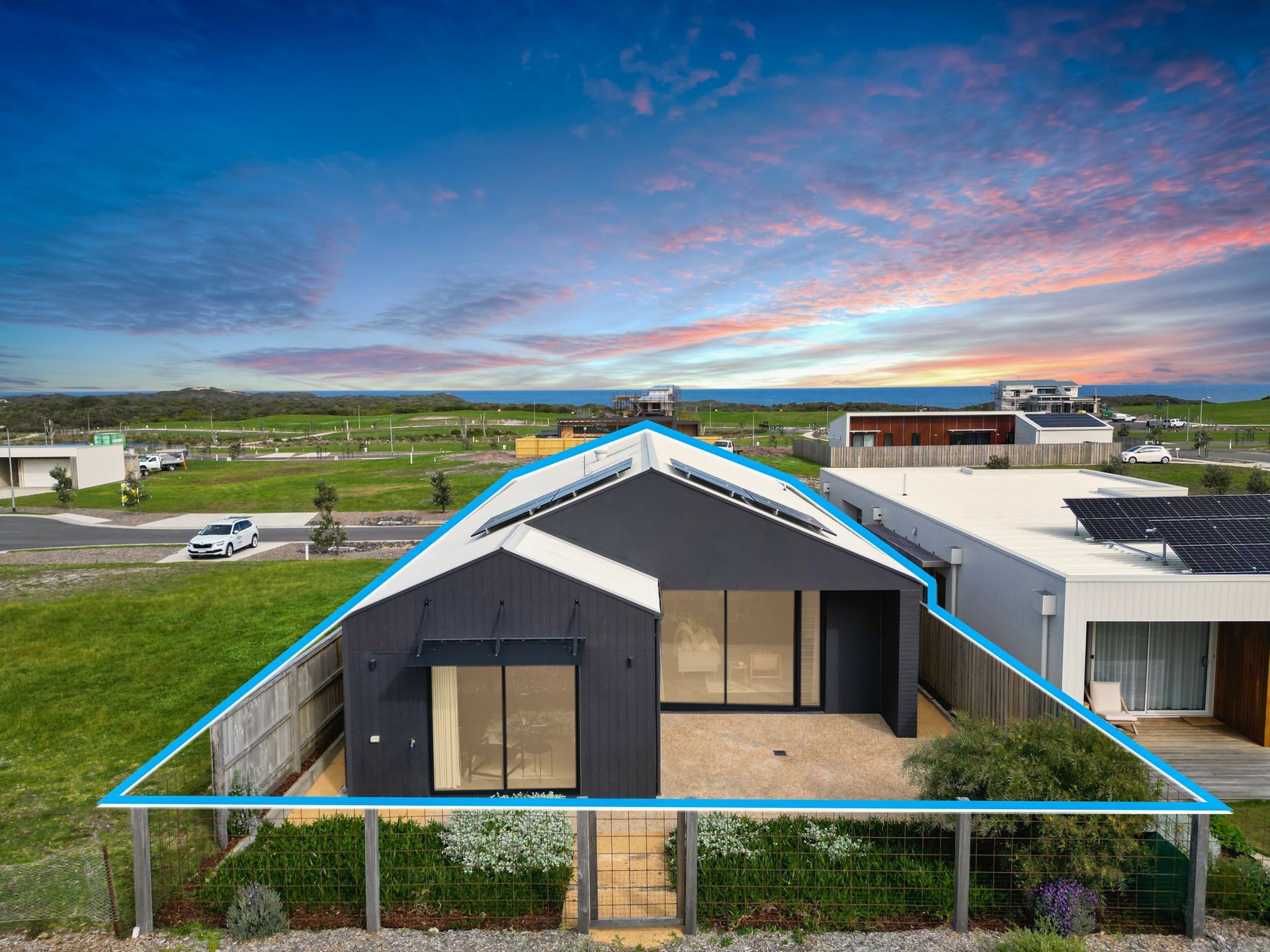 An aerial view of a house with a blue triangle around it.