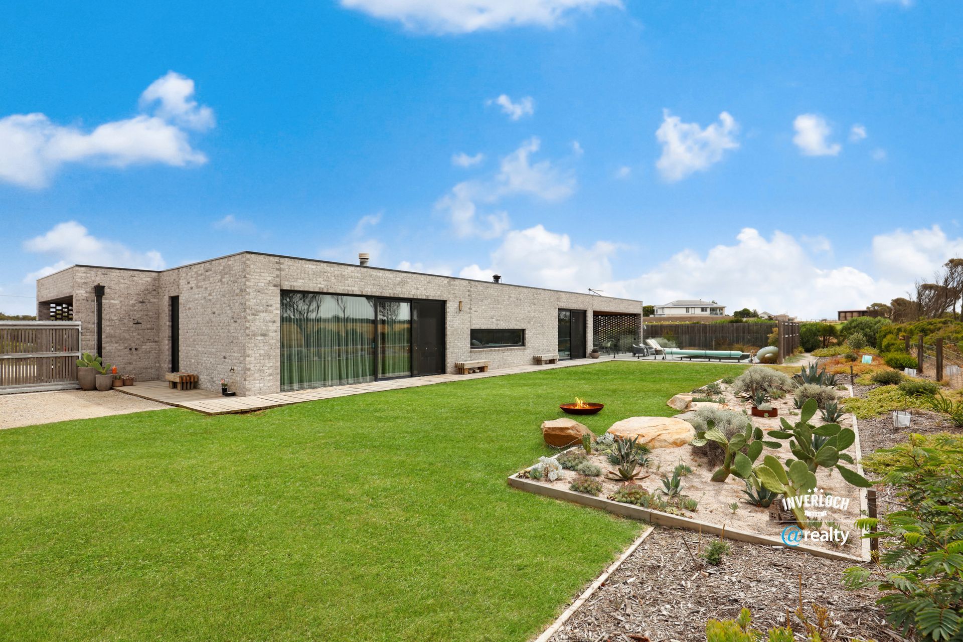 A large house with a large lawn in front of it.