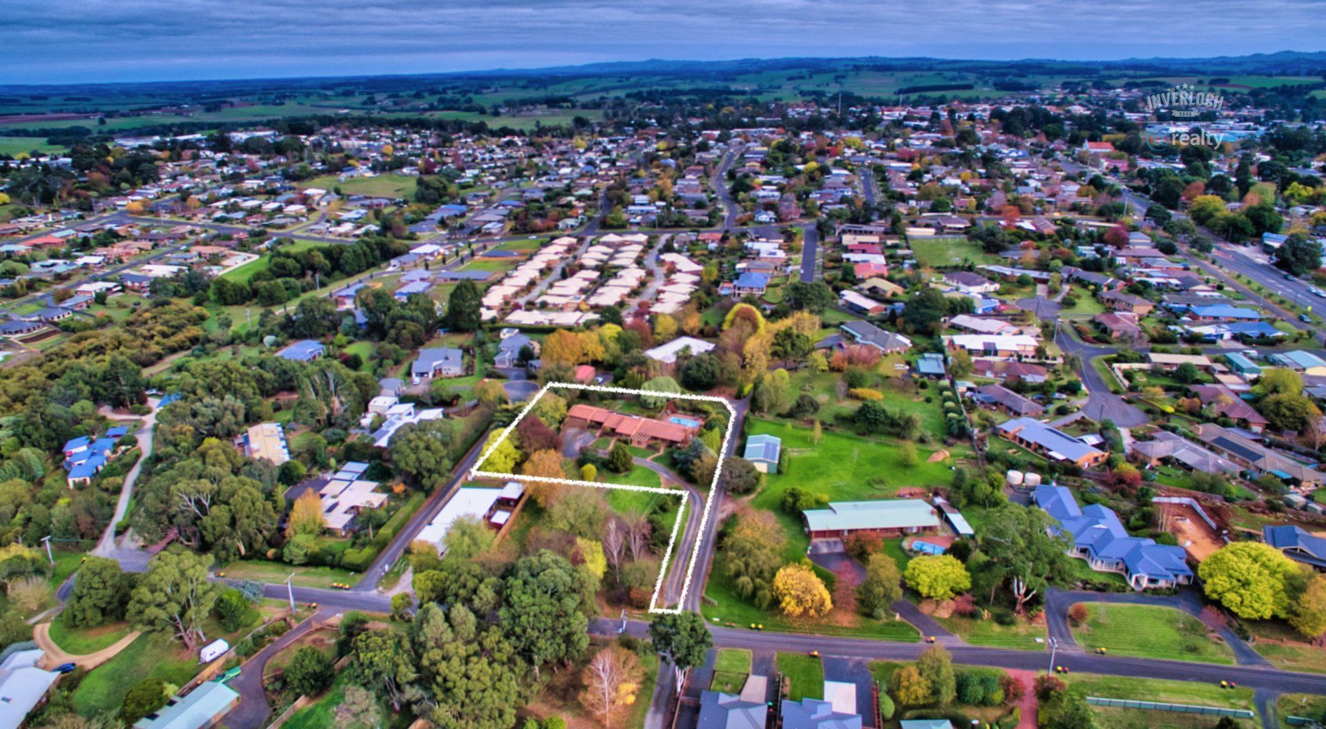 An aerial view of a residential area with lots of houses and trees.