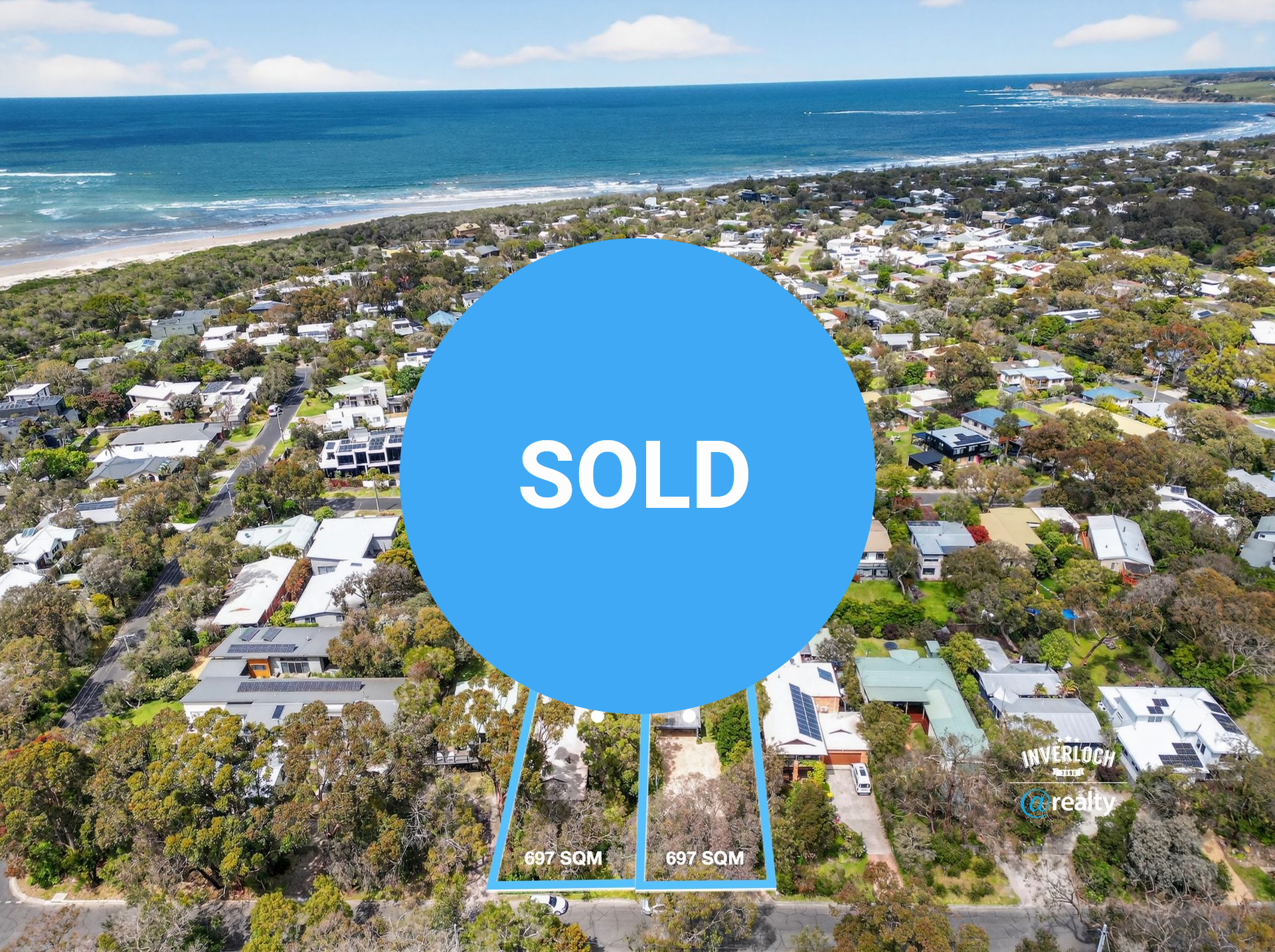 Aerial view of houses near the ocean, with a property outlined in blue, in a coastal area.