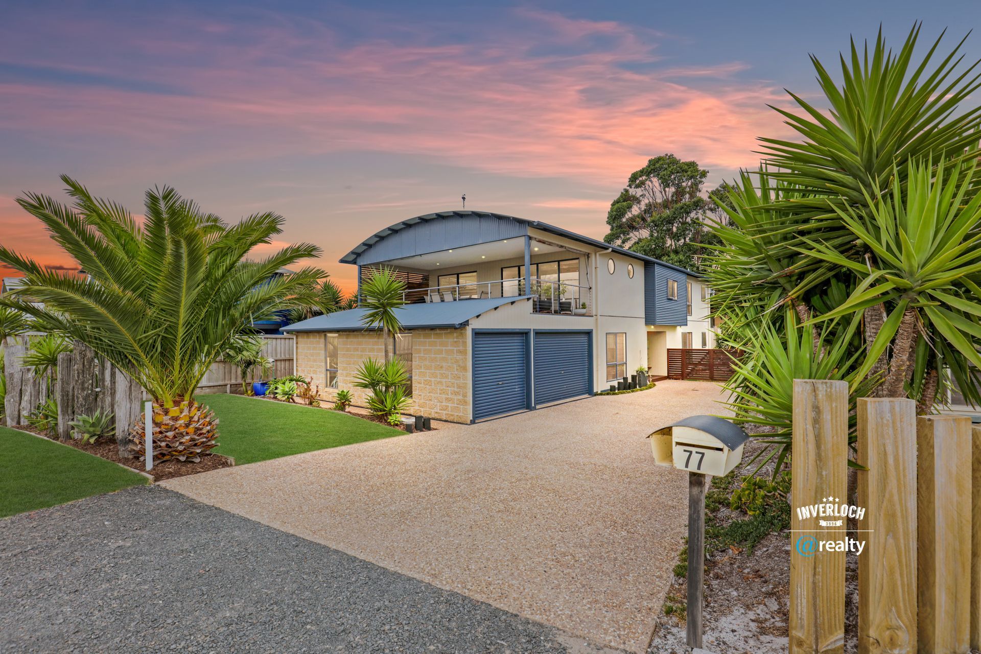 A large house with a mailbox in front of it is for sale.