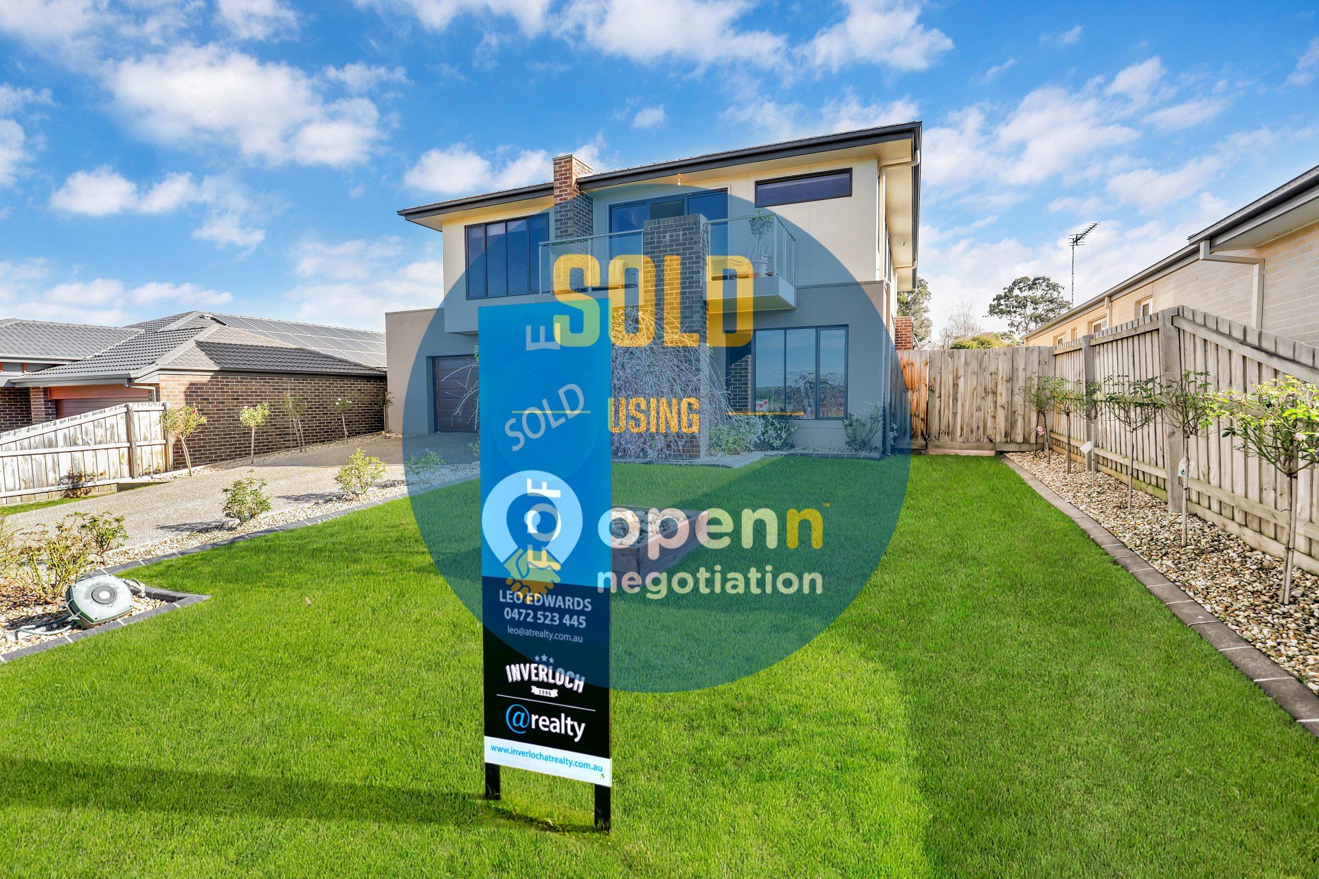 A house with a sold sign in front of it.