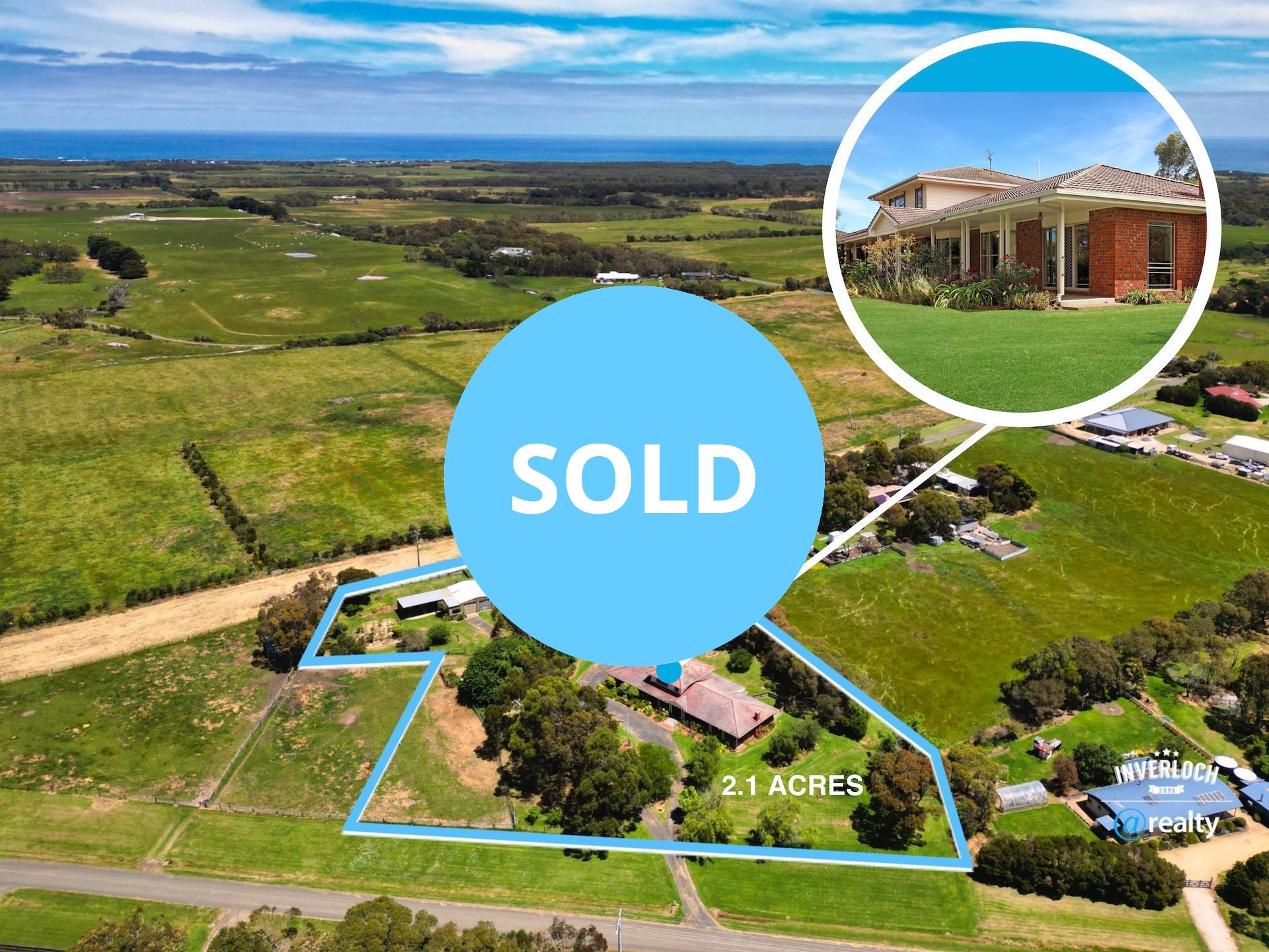 Aerial view of a sold property on 5.1 acres, with a house and surrounding green landscape; ocean in the background.