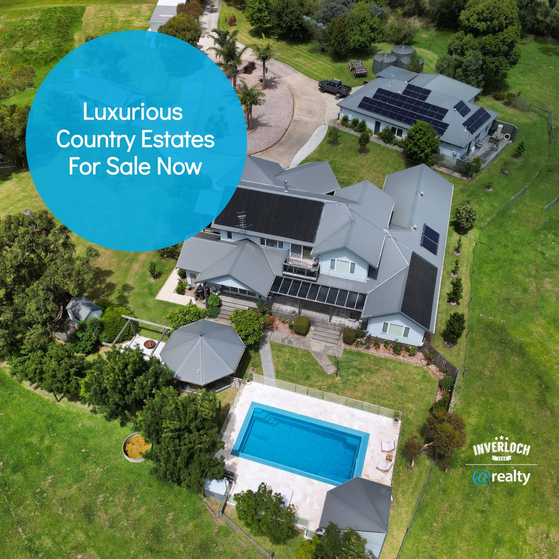 an aerial view of a luxurious country estate for sale