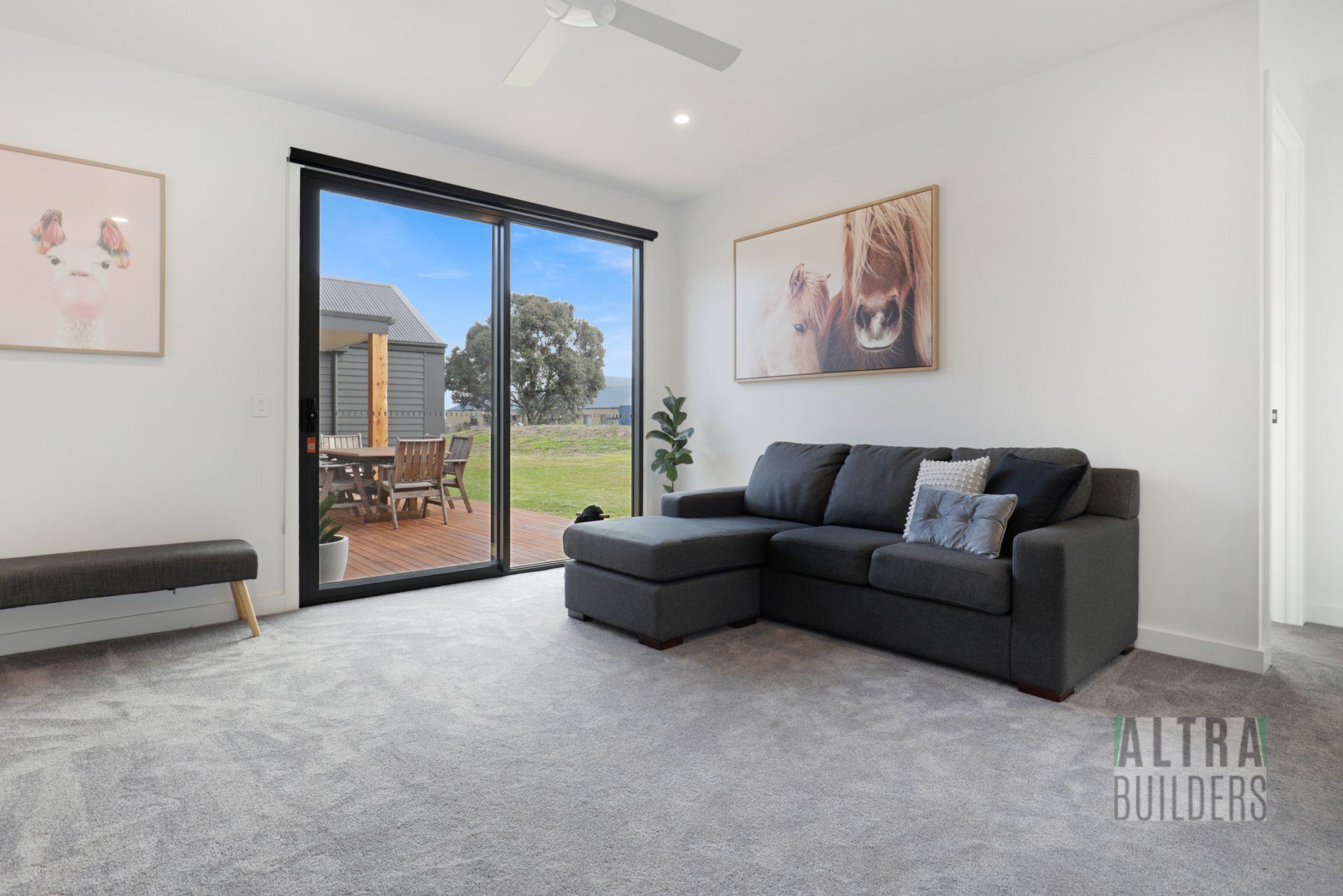 A living room with a couch and a sliding glass door