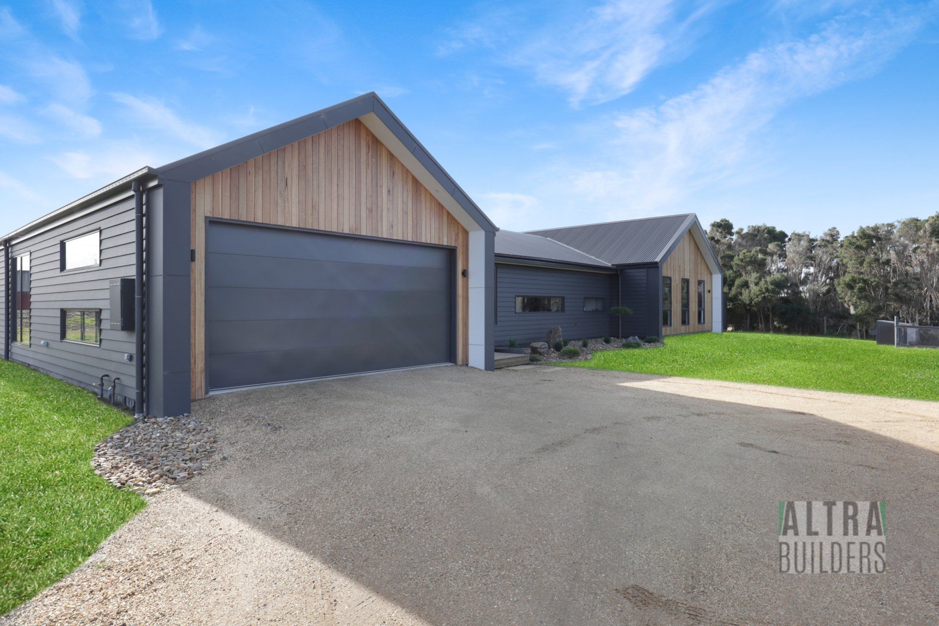 A large house with a garage and a driveway in front of it.