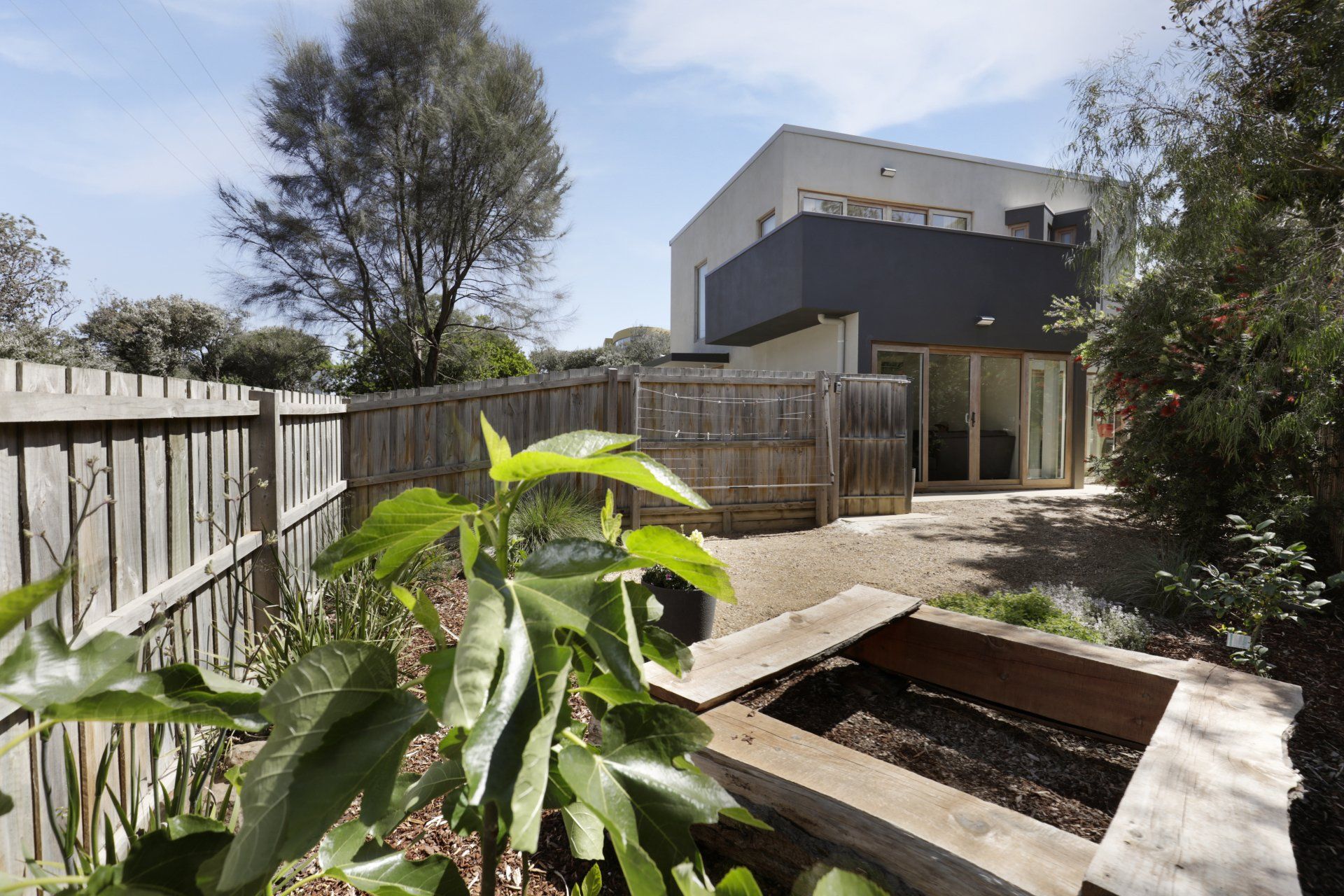 A house with a fence in front of it