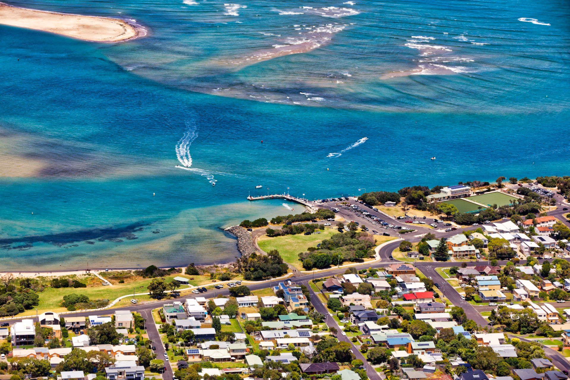 An aerial view of a city next to a body of water