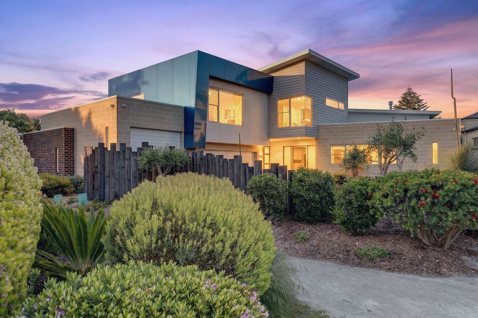 An aerial view of a house with a swimming pool