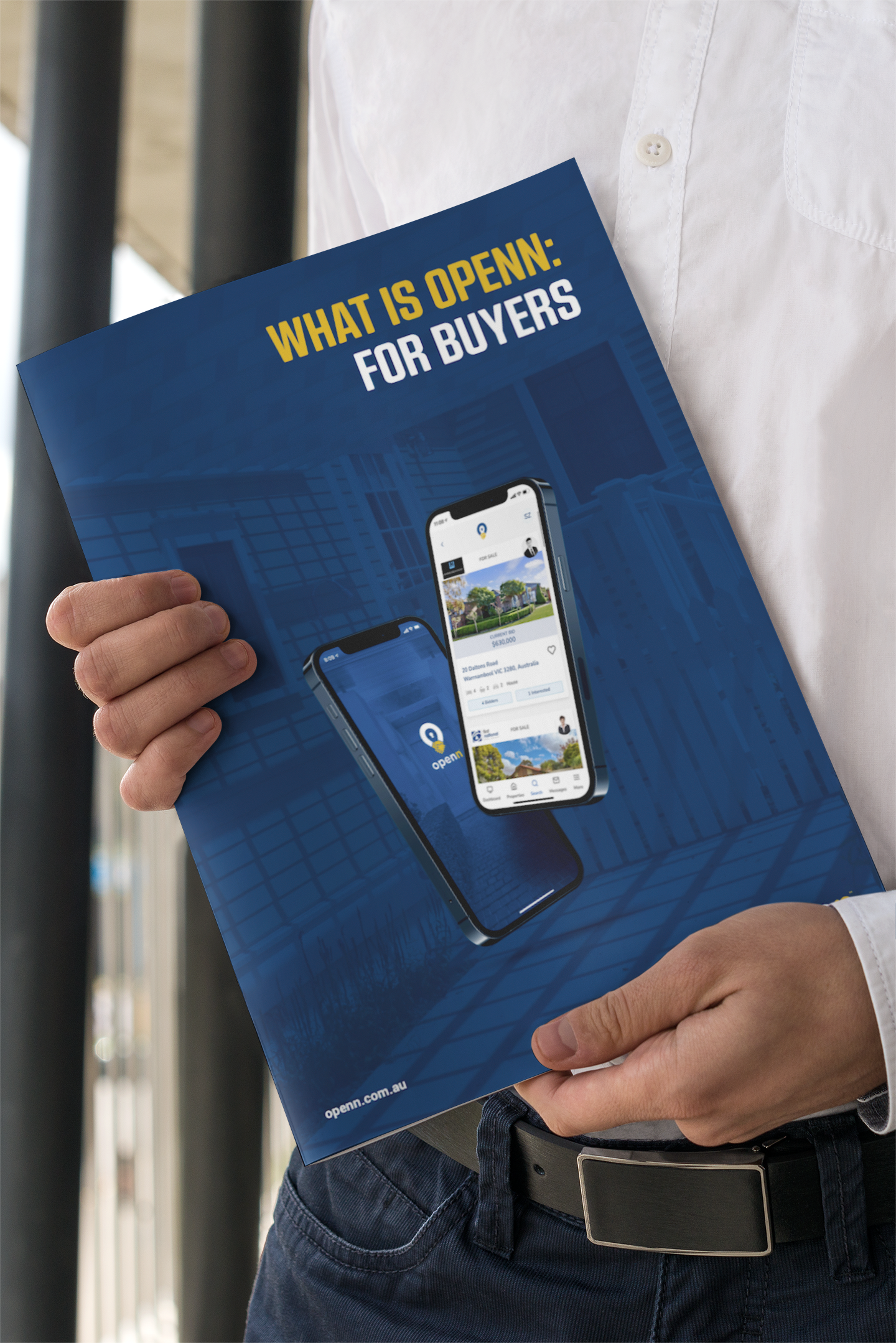 Person holding a blue brochure reading “WHAT IS OPEN? FOR DIVERS,” with a phone displayed on the cover.