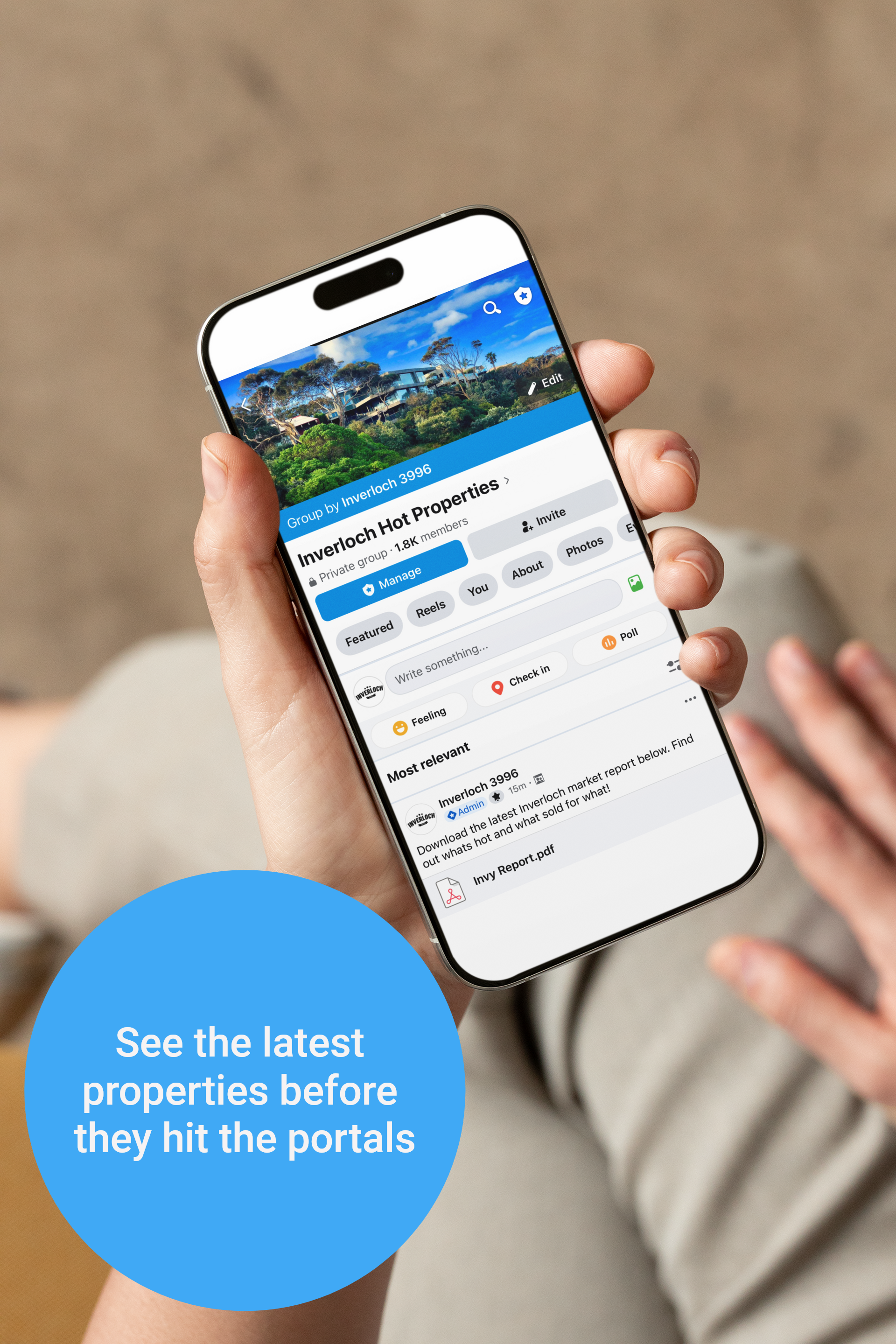 Person holding a phone displaying a real estate app with a mountain view, text: 
