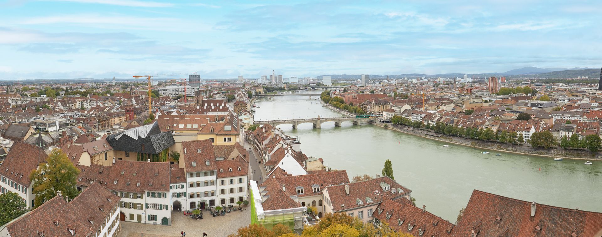 An aerial view of a city with a river running through it.