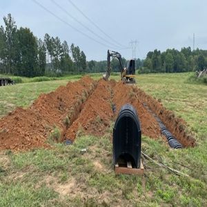 A bulldozer is digging a hole in the dirt.