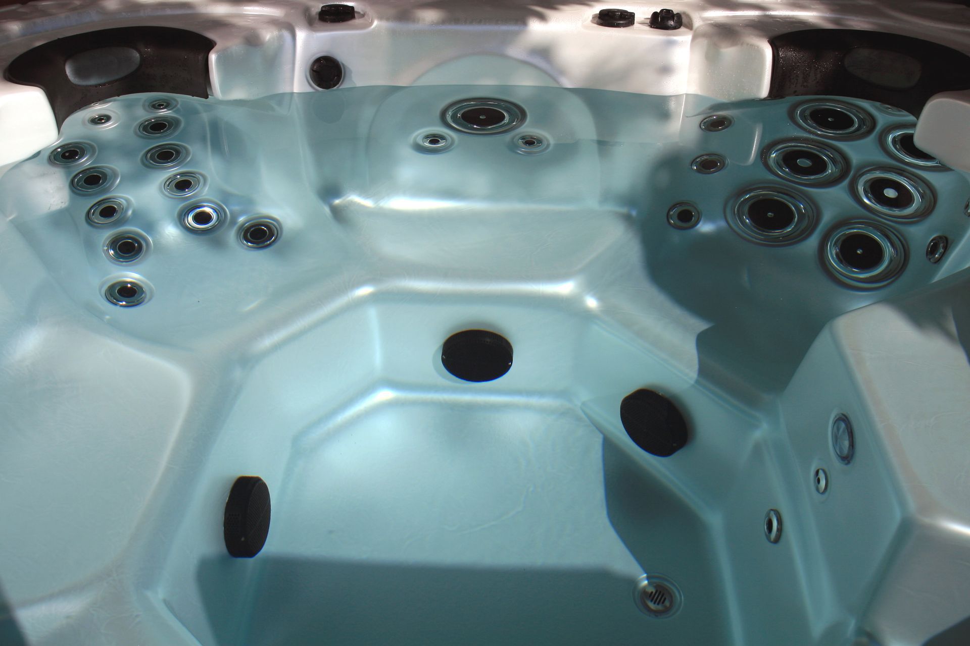 Hot tub filled with water and ready for use after professional installation. Hot tub filled with water and ready for use after professional installation.