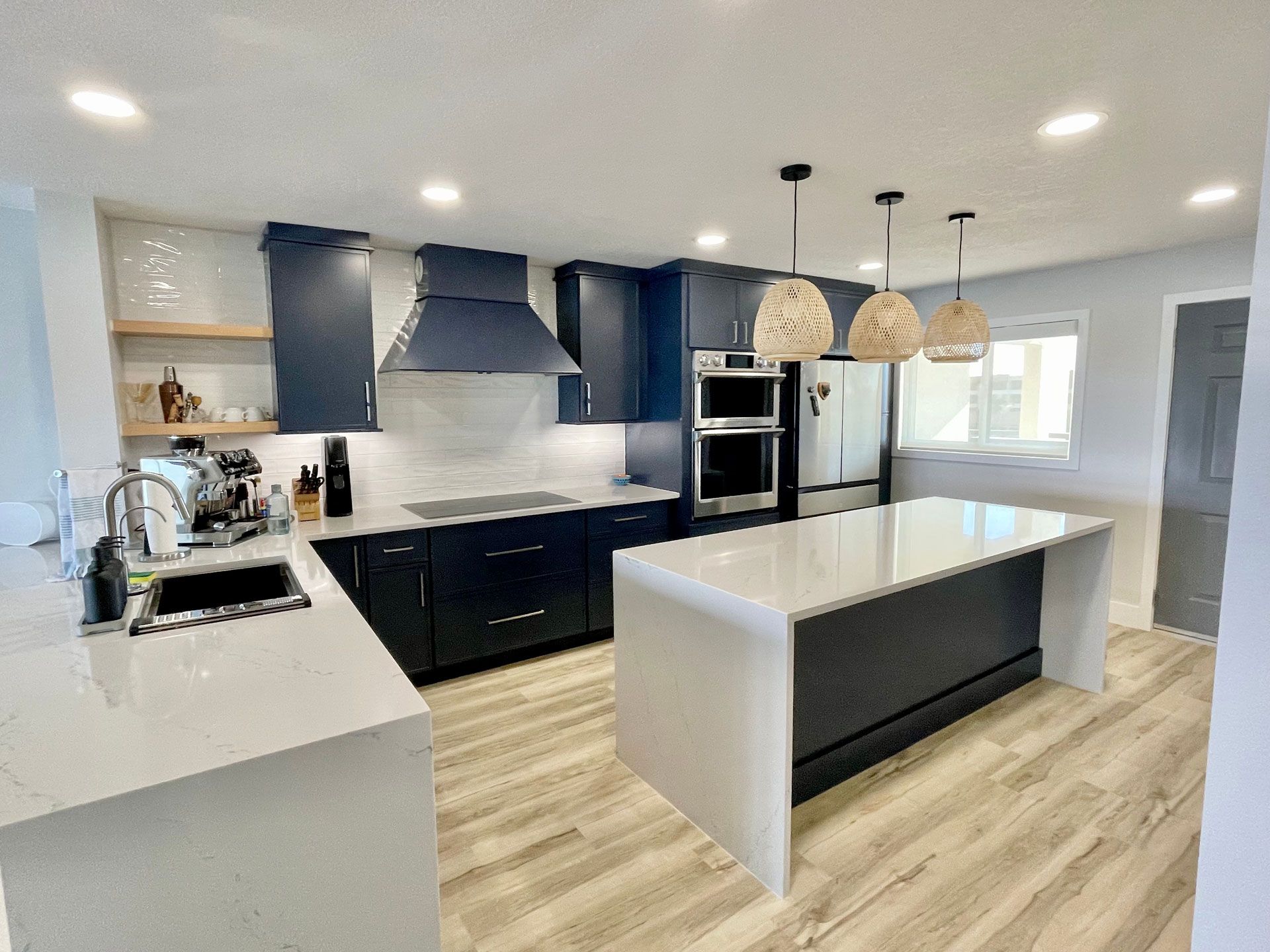 A kitchen with a large island in the middle of it.