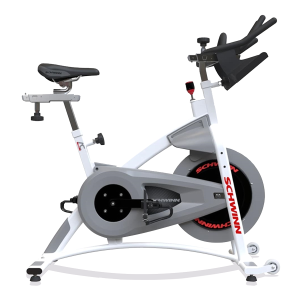 Schwinn indoor cycling bike, white and gray with a black seat, red accents, wheels.