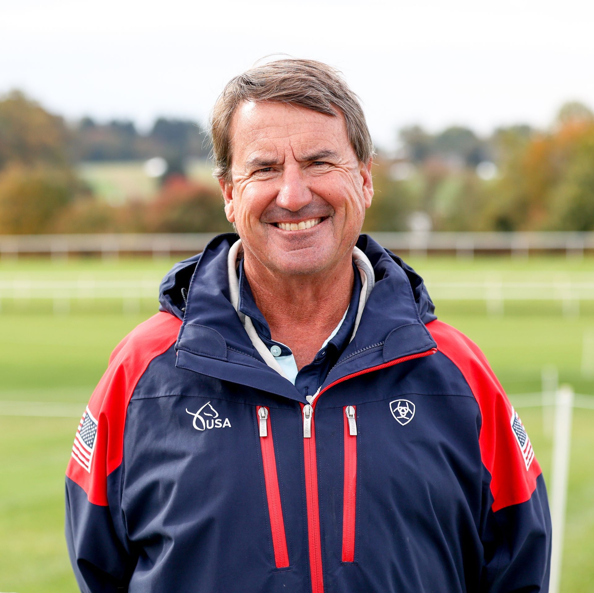 A man wearing a blue and red jacket with the word usa on it