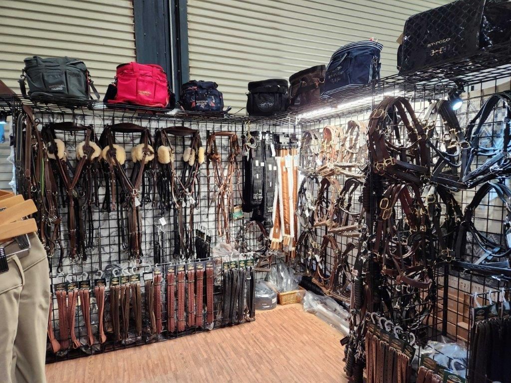 A store filled with lots of belts and bags.