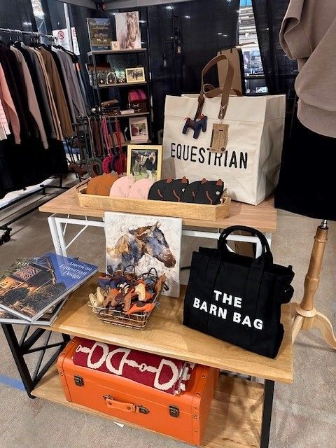 A table with a bag that says equestrian on it