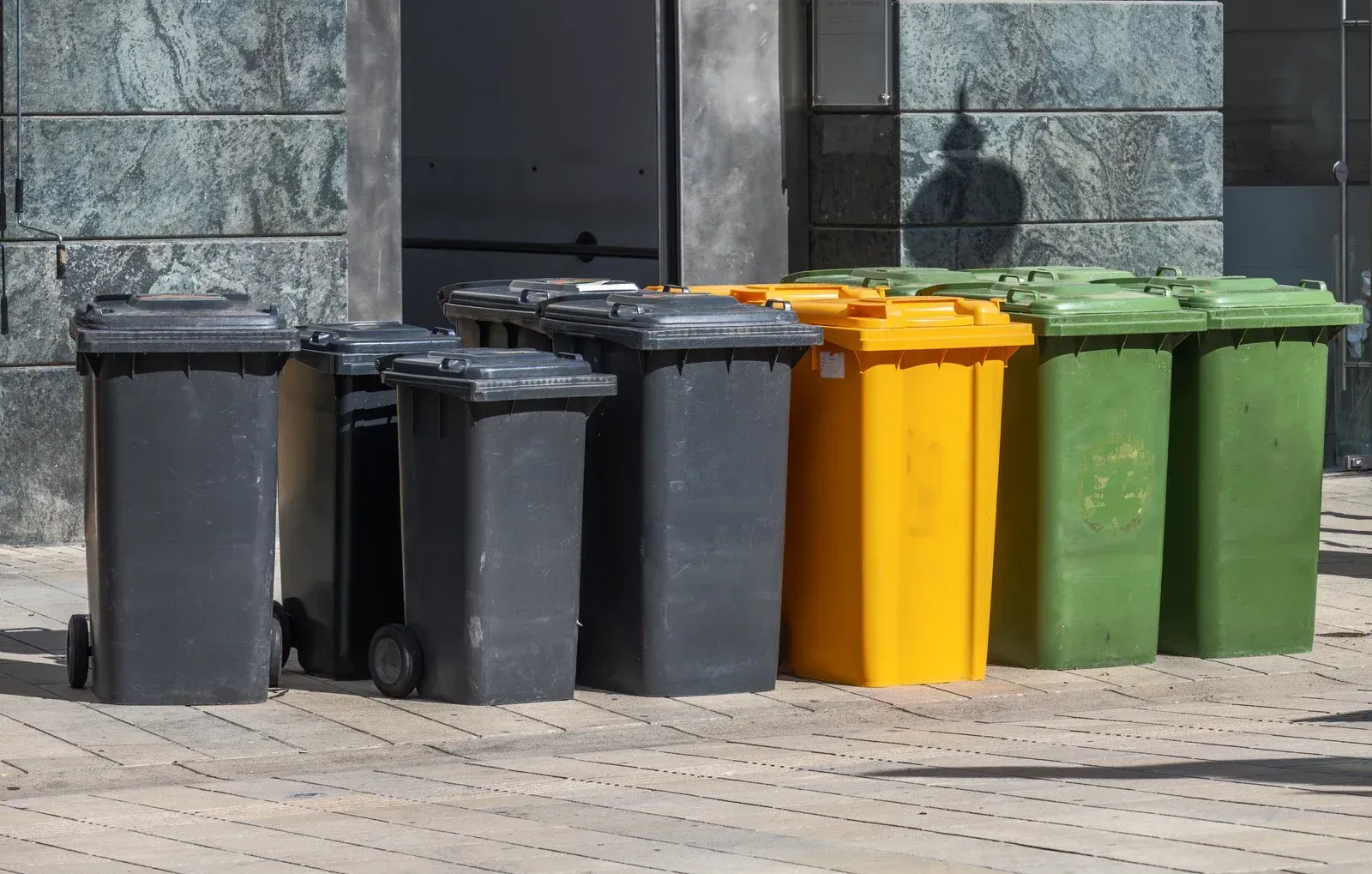 A pile of rubble is sitting on the side of the road.