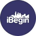 The logo for i begin is a circle with a city skyline in the middle.