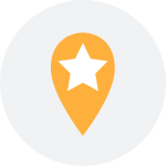 A yellow pin with a white star on it in a white circle.