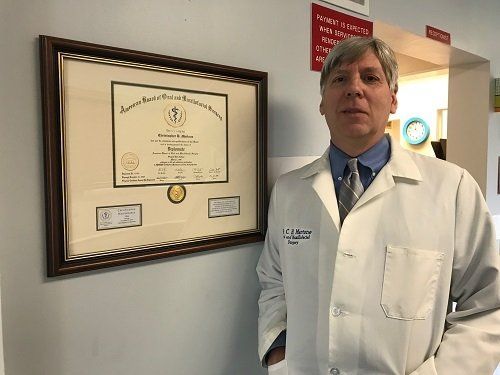 Dr. Christopher H. Martone Beside His Certificate | Natrona Heights, PA | Christopher H Martone
