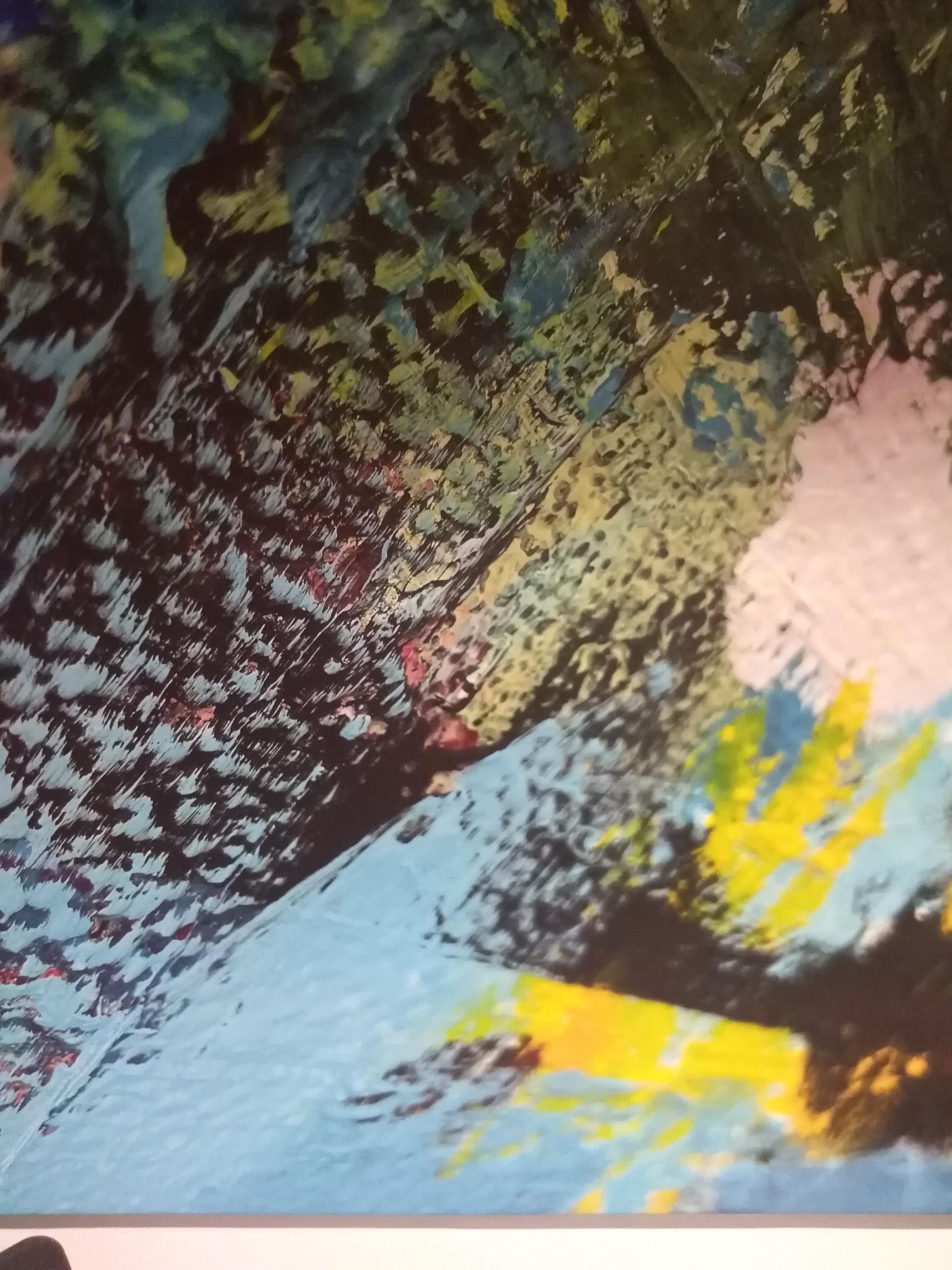 Abstract painting with blue, yellow, green, and black brushstrokes.