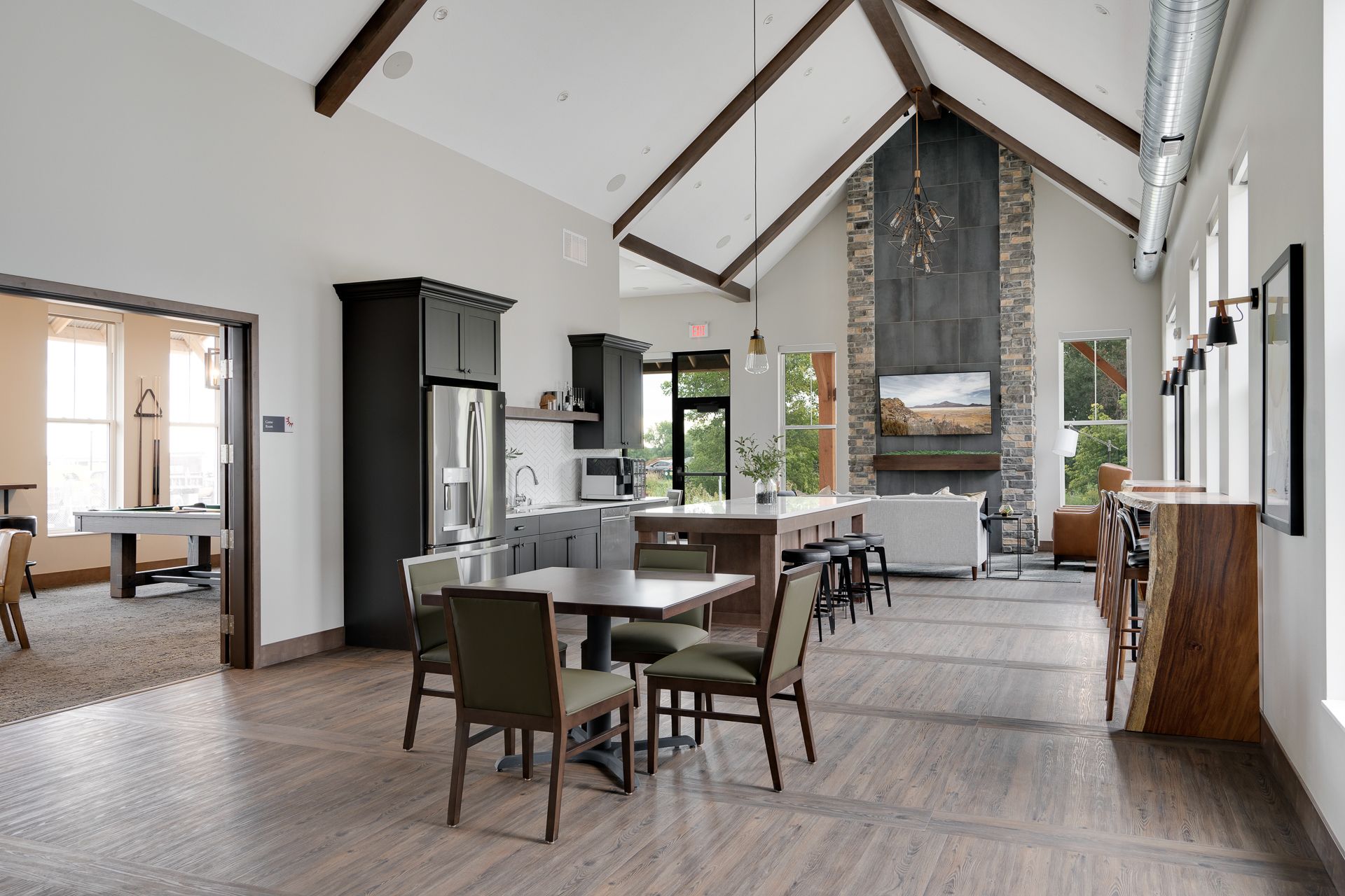 A large room with a table and chairs in it